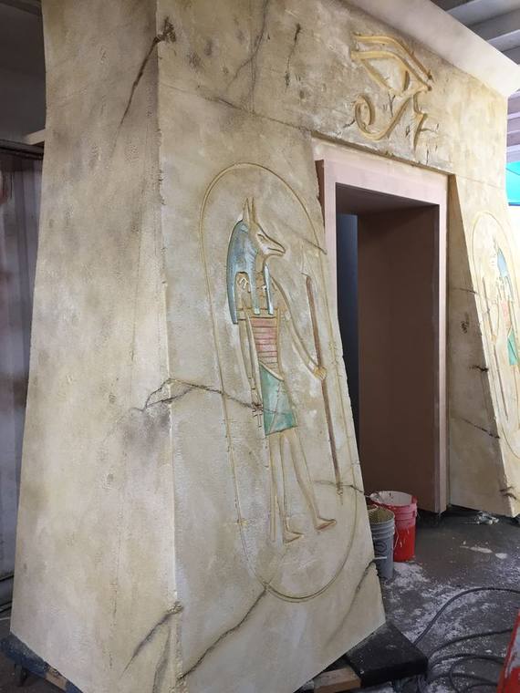 Hand-carved hieroglyph relief panels, finished in the shop
