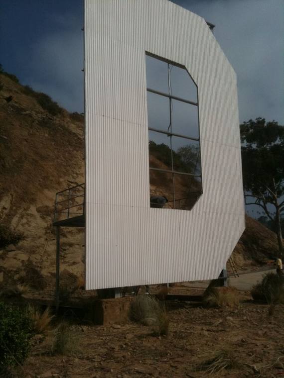 Monumental letter built in steel and installed on a hillside