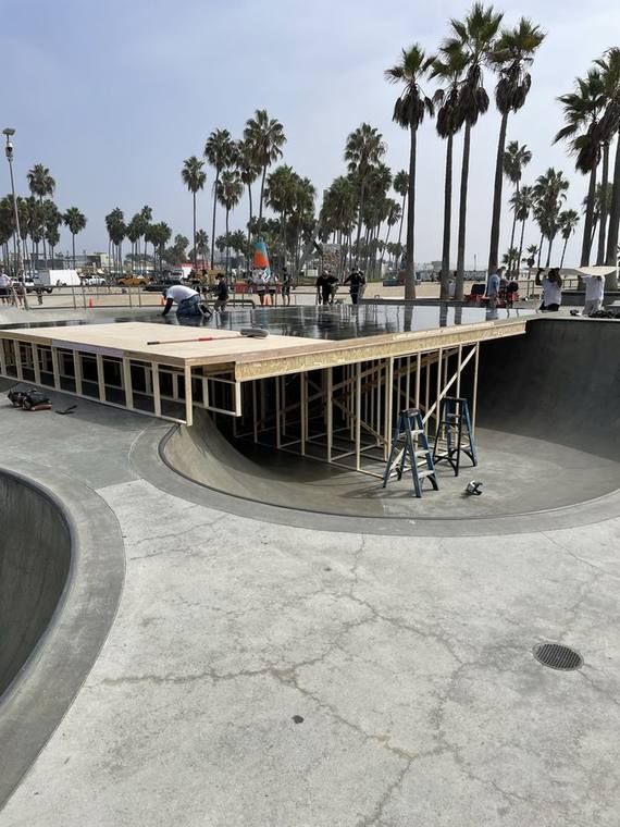 Platform deck framed over a skate bowl, in and out in one day