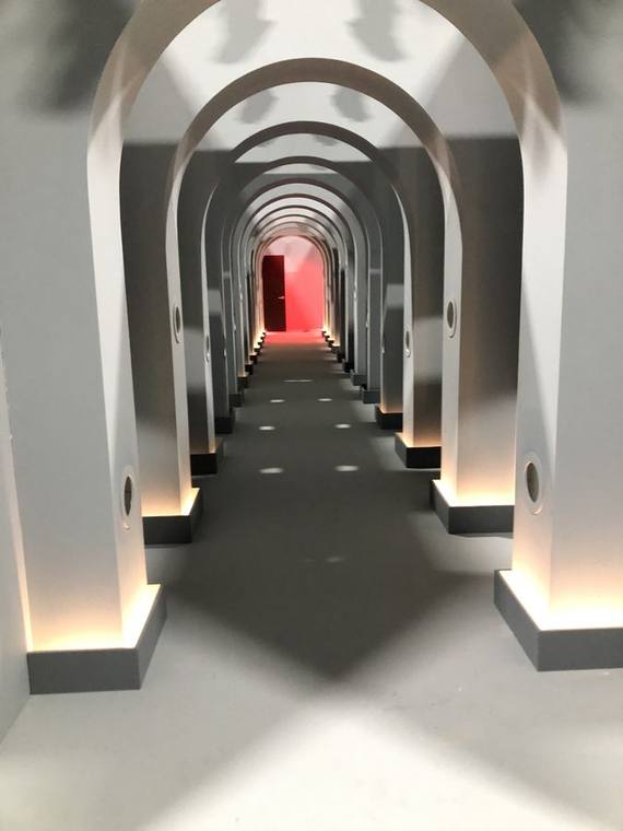 White arch corridor built in forced perspective